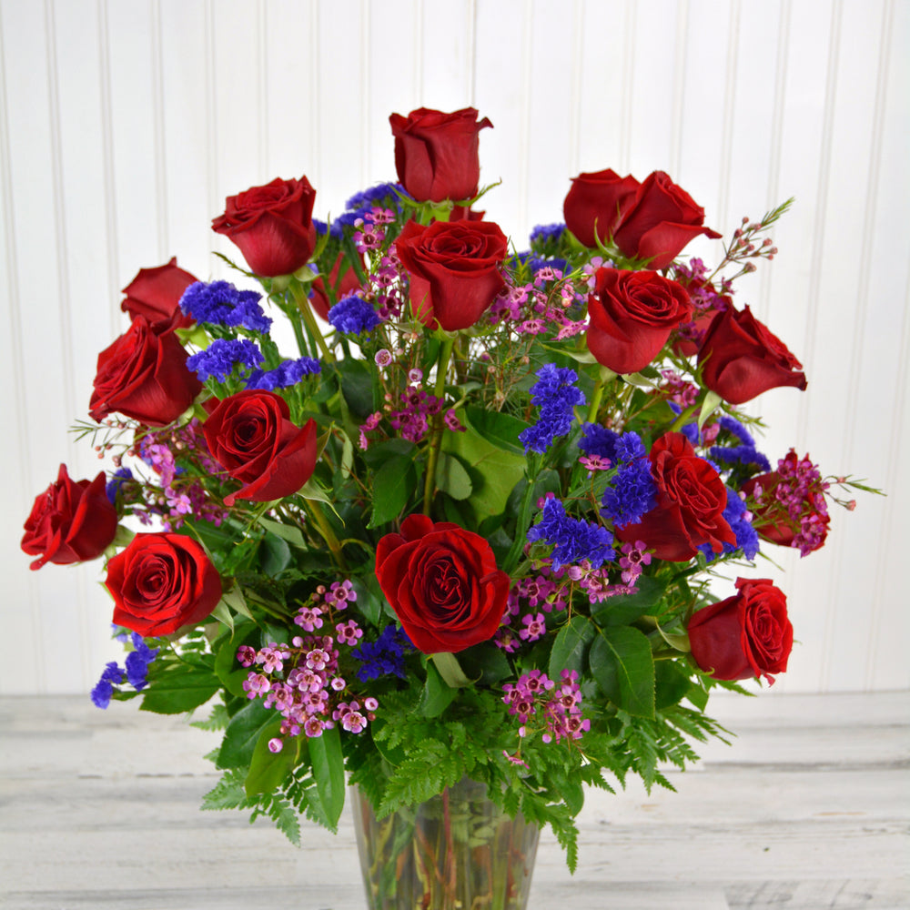 Two Dozen Long Stem Red Roses with Complimentary Flowers